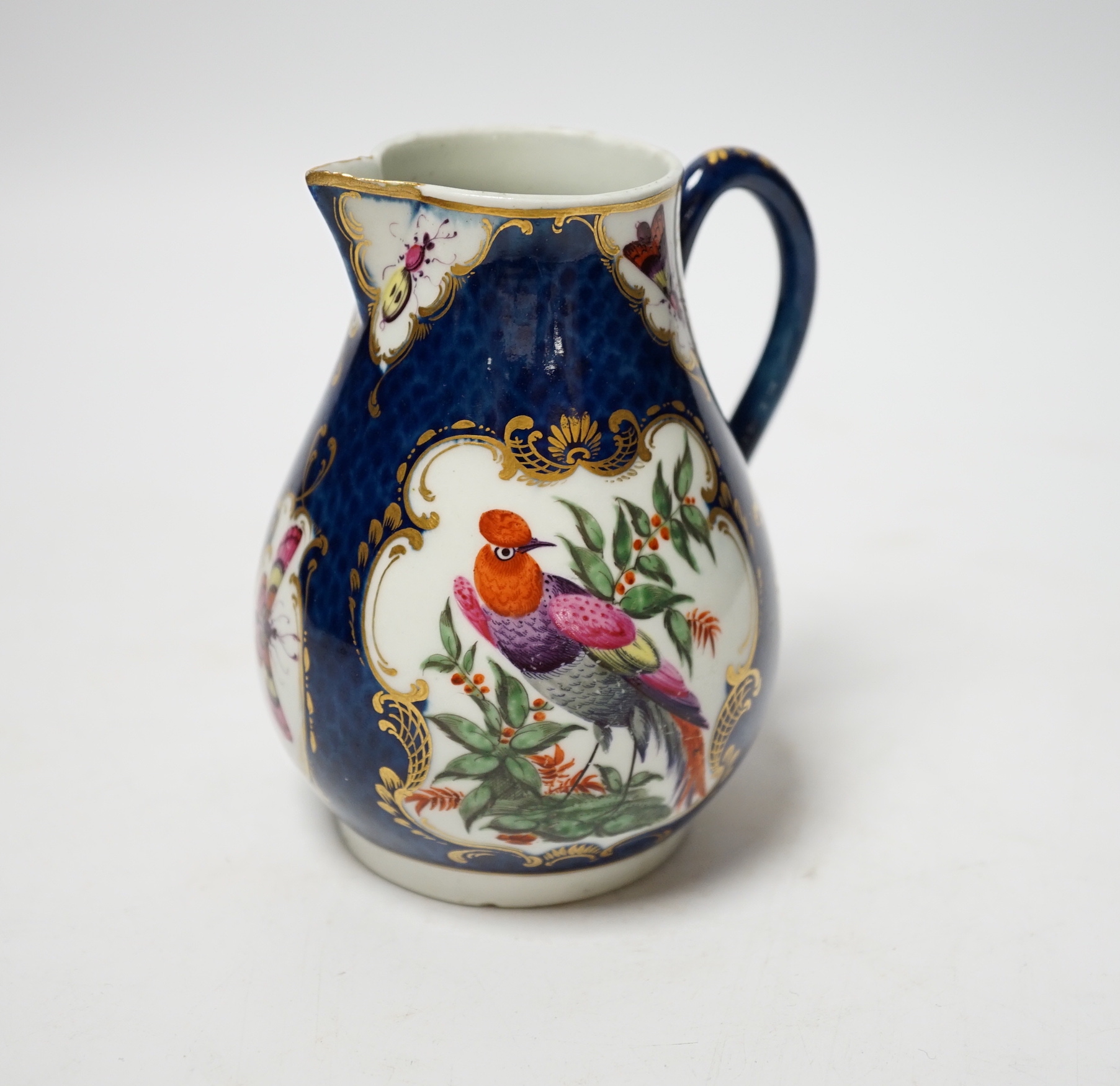 An 18th century Worcester blue scale jug, 11cm